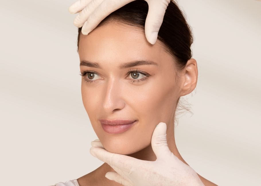 latex gloves touching womans face before treatment