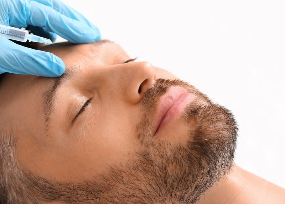 man receiving frown line treatment