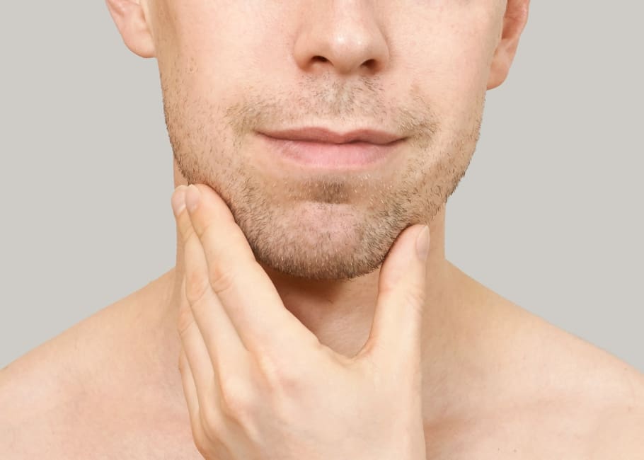 man touching his chin