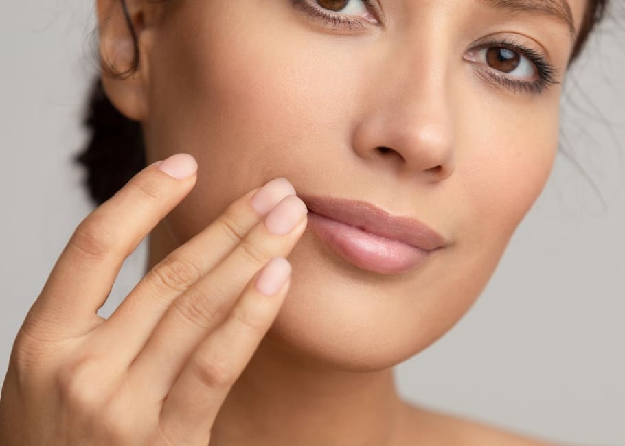 naturally beautiful woman touching lips