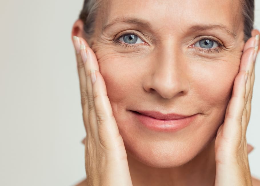 smiling woman touching her face