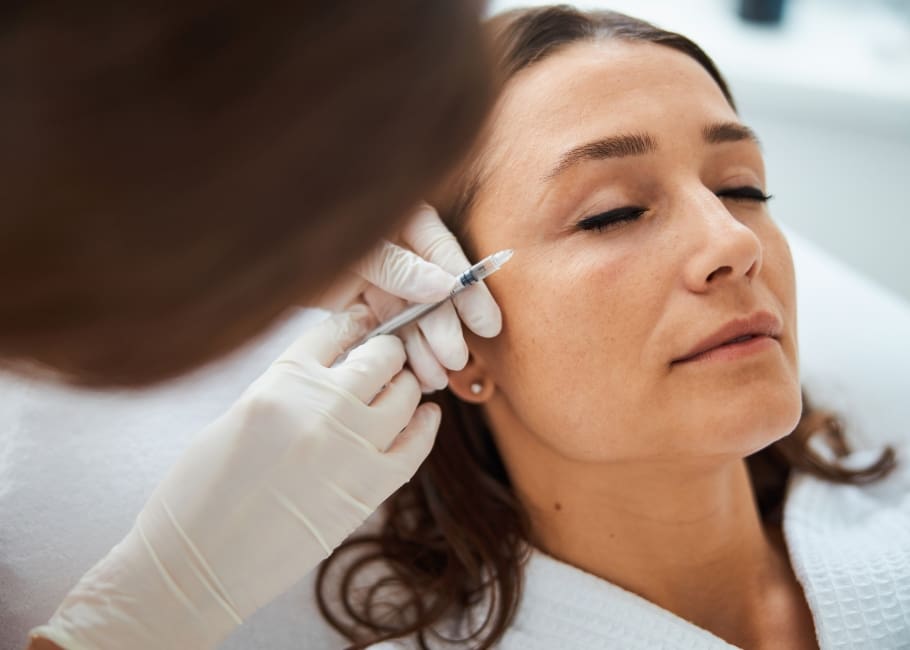 woman getting crows feet treatment