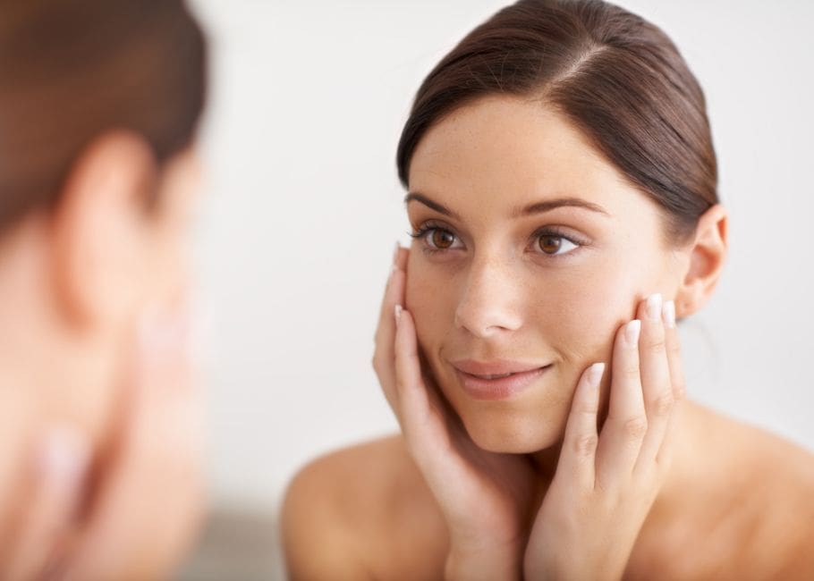 woman looking after skin after tear trough treatment