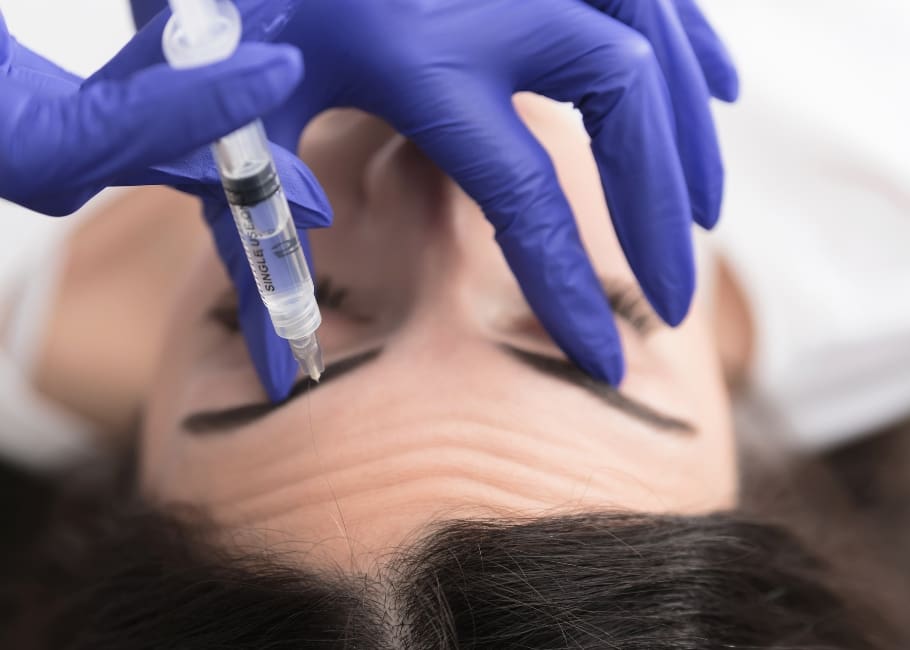 woman receiving forehead treatment