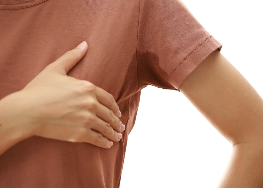 woman sweating through her shirt