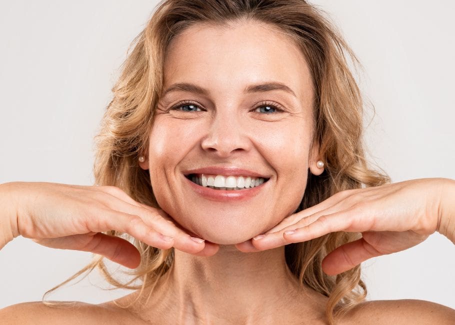 Skincare For Aging Skin. Portrait Of Beautiful Smiling Middle Aged Woman